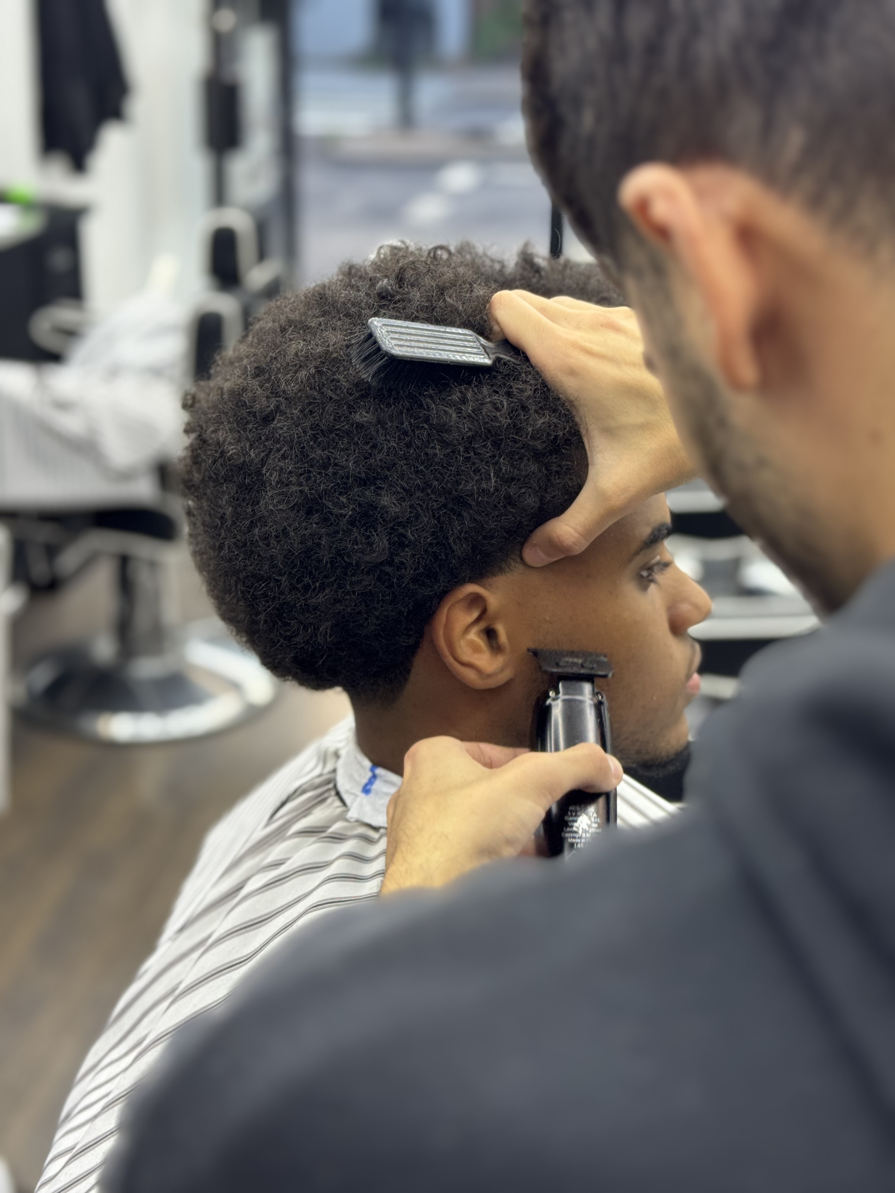 Finished skin fade and classic styled haircut