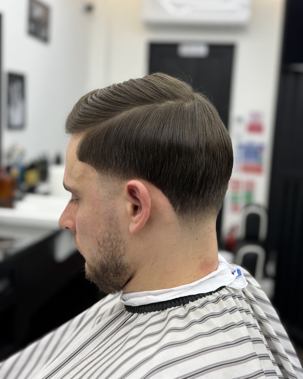 Textured haircut with a clean tapered finish
