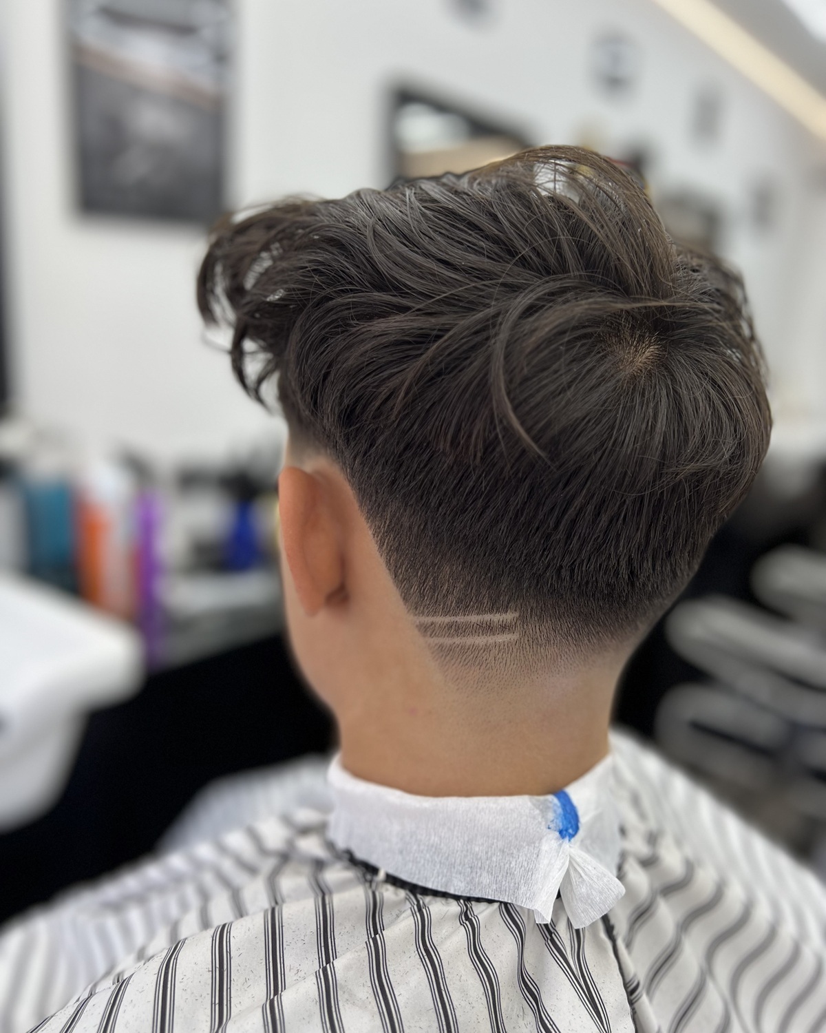 Styled haircut with a shaped beard