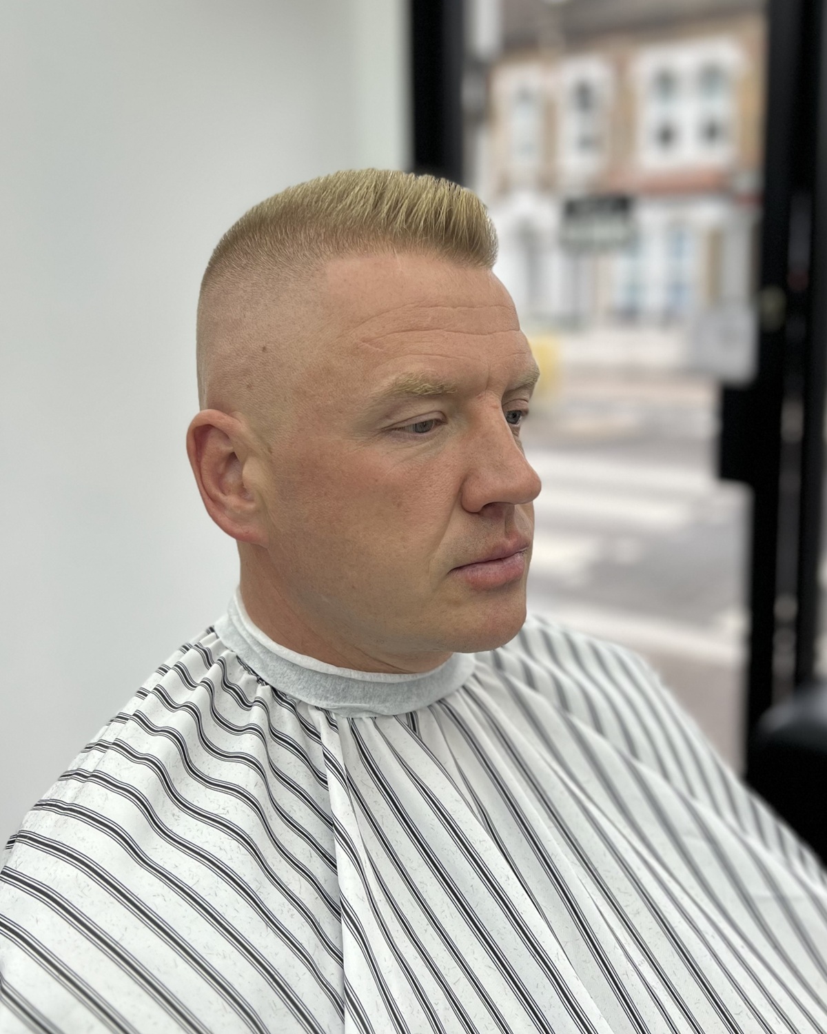 Fresh short haircut with a detailed fade